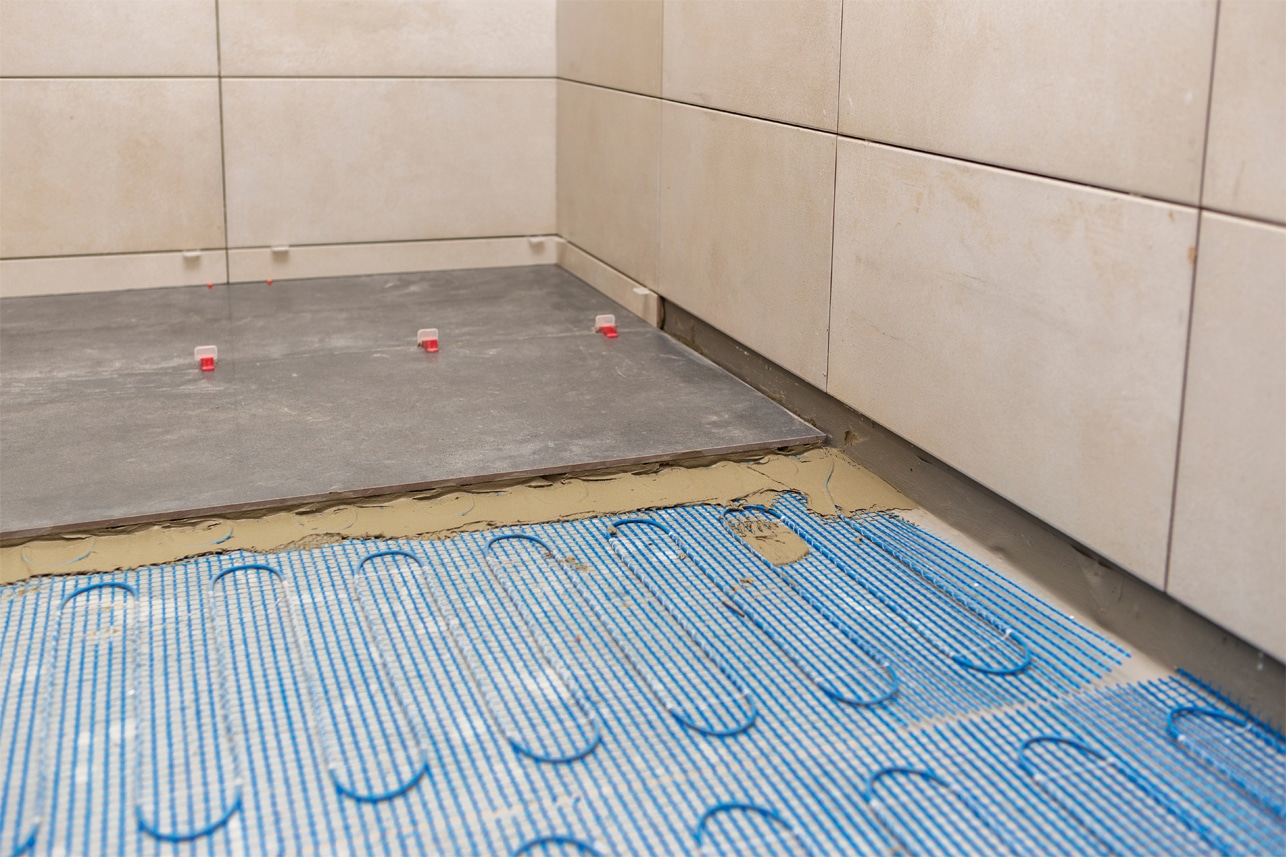 Heated floor being installed in a new shower by Pat Green Heating & Cooling