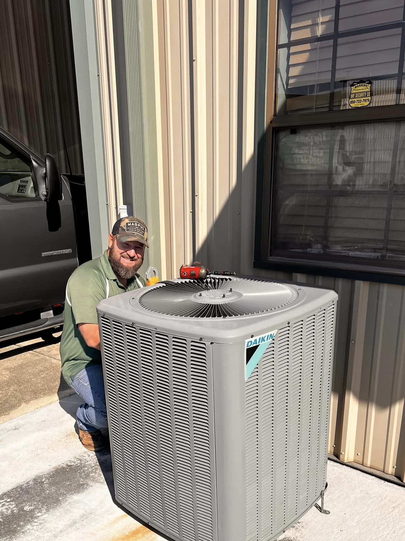 Pat Green Heating & Cooling employee making repairs on a daikin HVAC unit